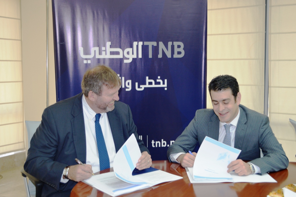 البنك الوطني يوقع اتفاقية لشراء نظام بنكي عالمي مع شركة Temenos الدولية
