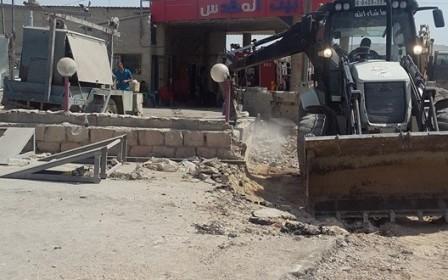 الأشغال العامة تواصل العمل في إعادة تأهيل شارع قلنديا
