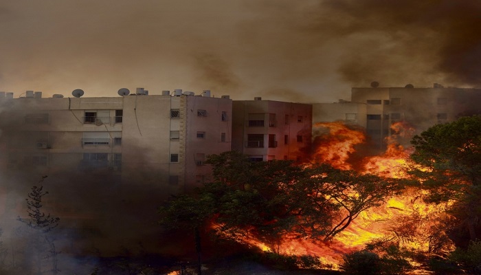 إخلاء عشرات المنازل جراء حرائق بأراضي 48
